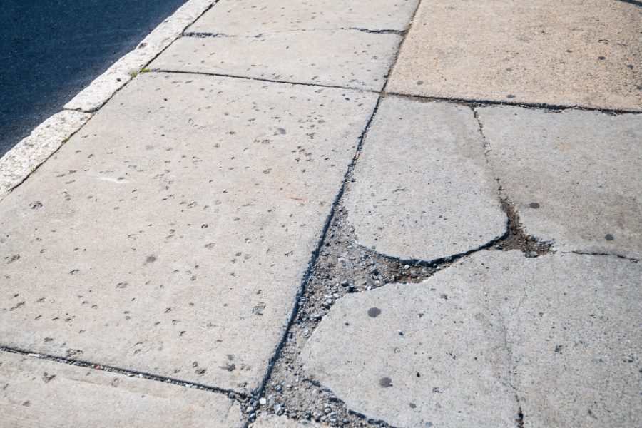 Cracked concrete terrace surface showing wear that can allow water penetration