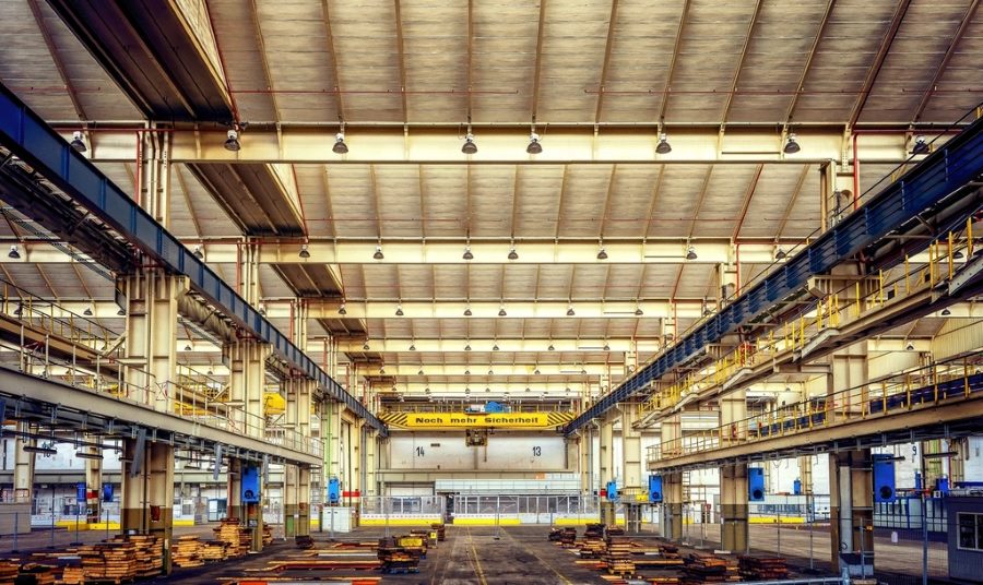 Industrial factory floor prepared for a protective epoxy coating system