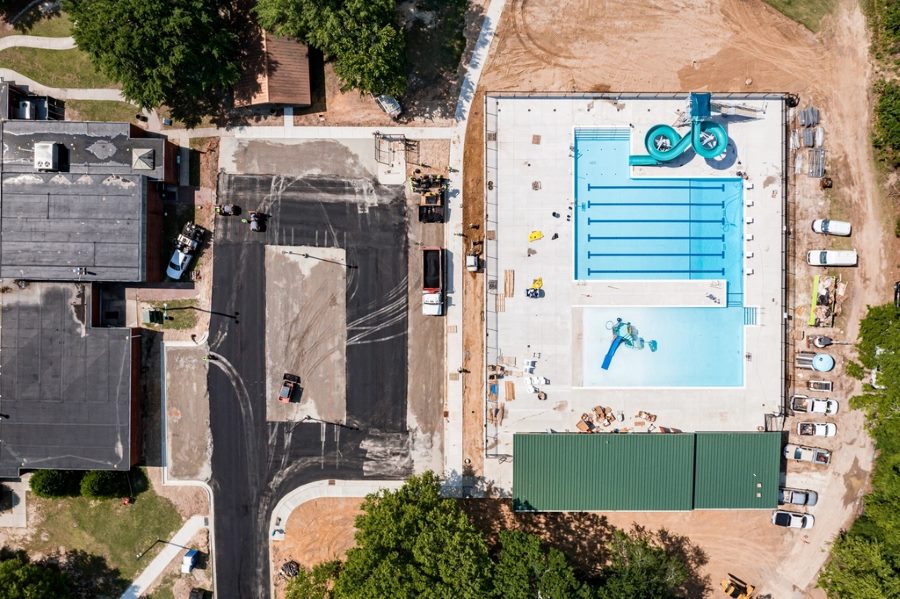 Swimming pool construction with concrete deck and waterproofing preparation work
